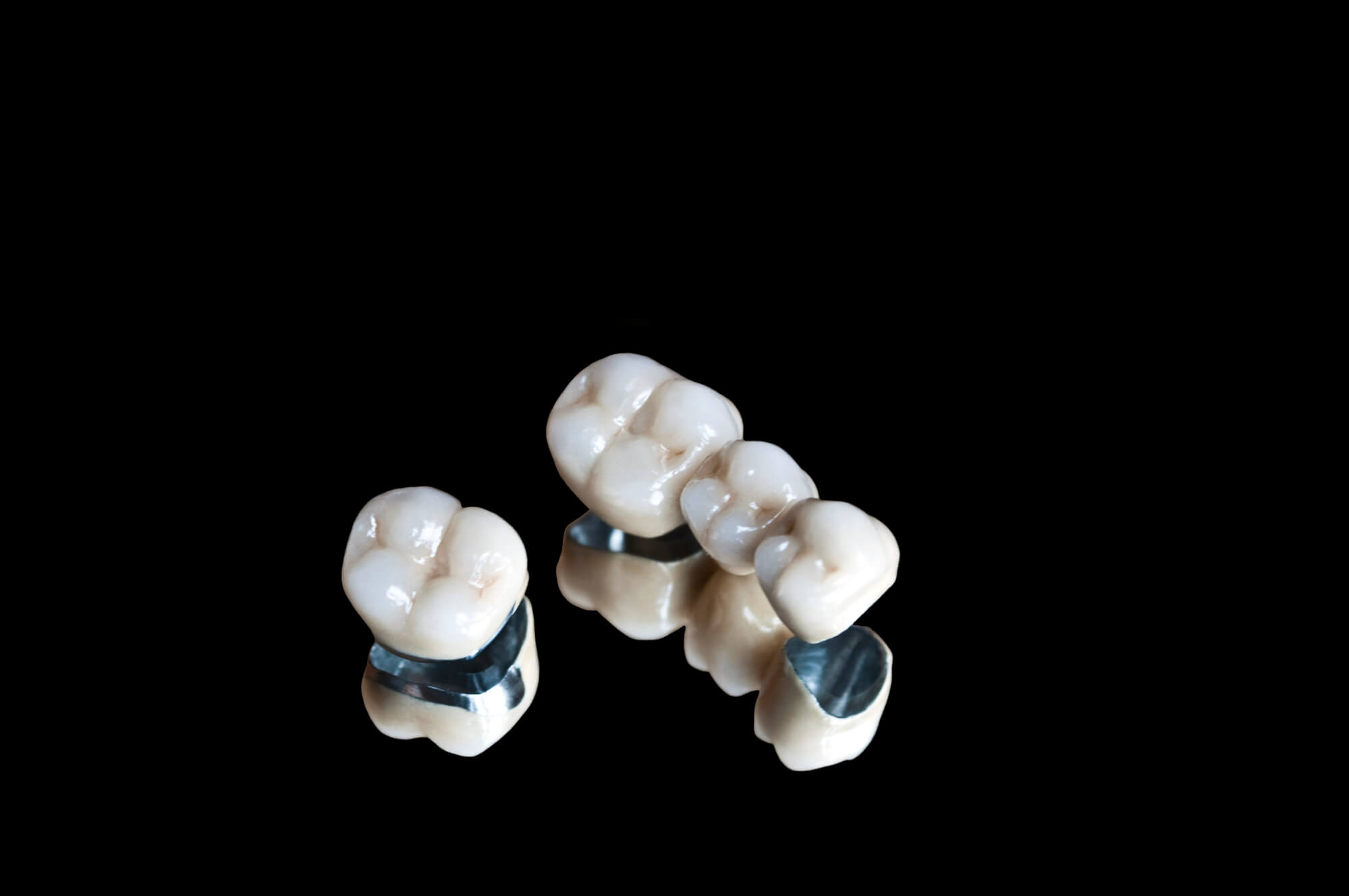 dental crowns wilmington on black bacground