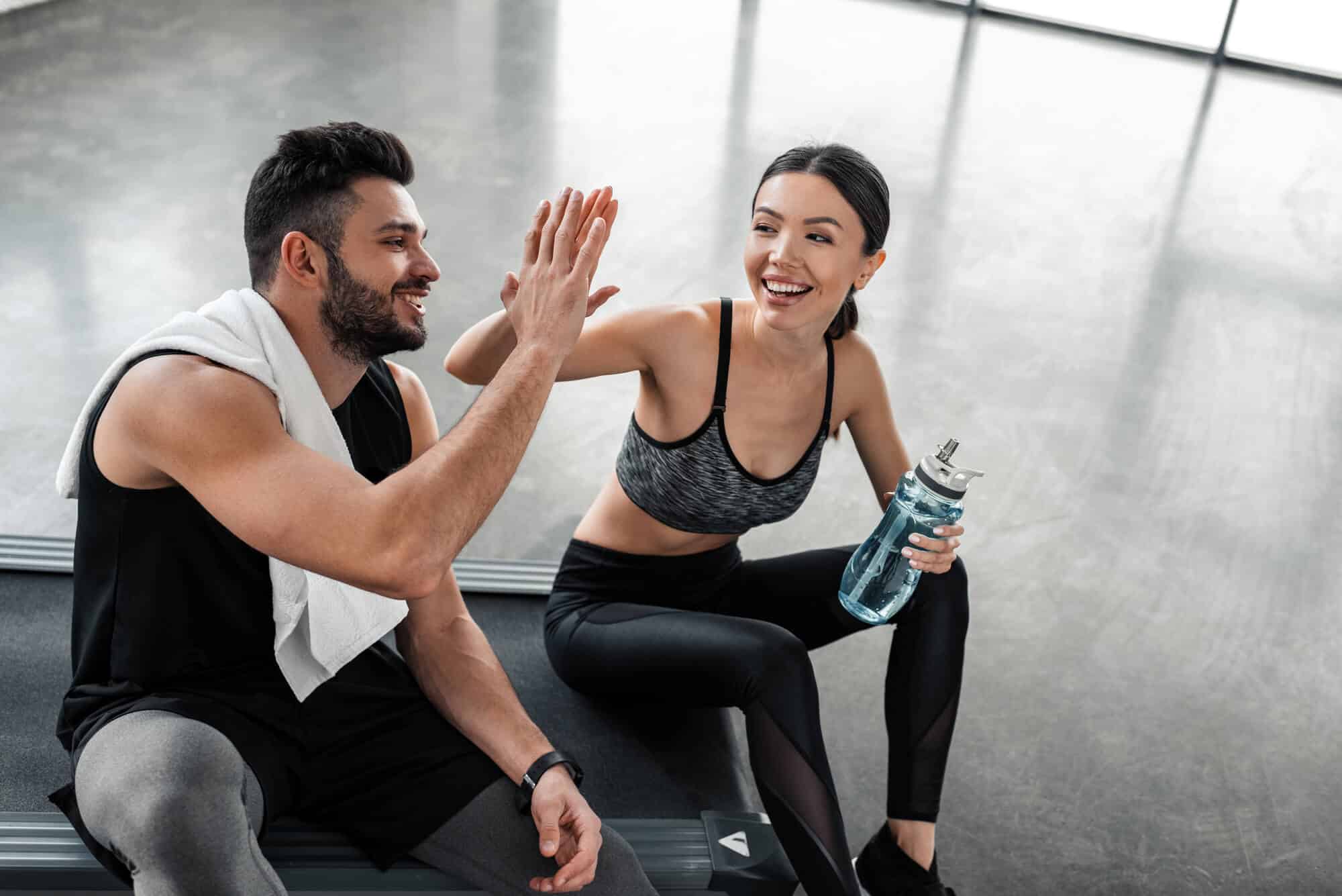 couple working out after dentist clears them post tooth extraction wilmington